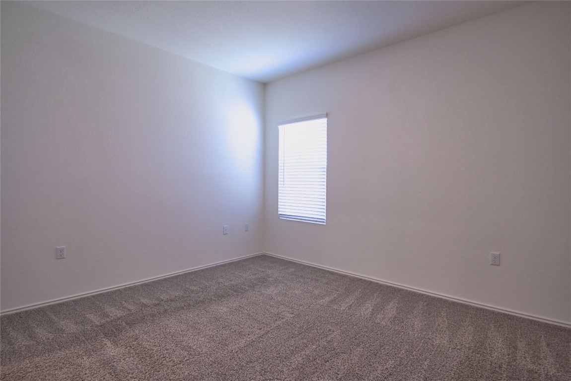 2233 Forgetmenot Lane Pflugerville, TX 78660 - Photo 21 of 28 an empty room with a window