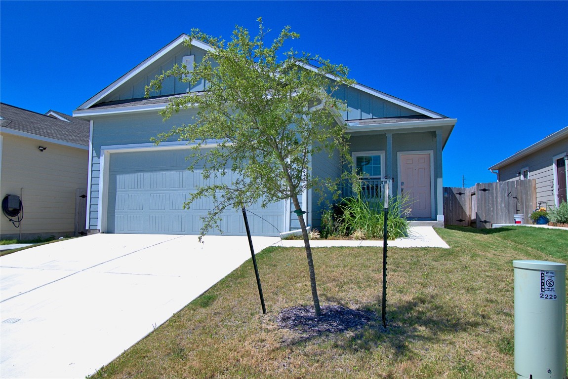 2233 Forgetmenot Lane Pflugerville, TX 78660 - Photo 3 of 28 a house view with a backyard space