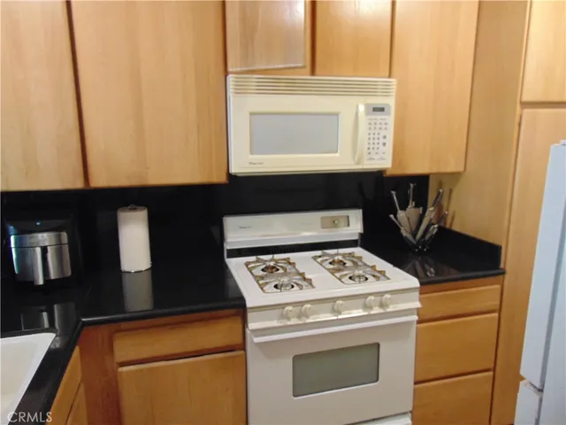 a bathroom with a sink a mirror and a shower