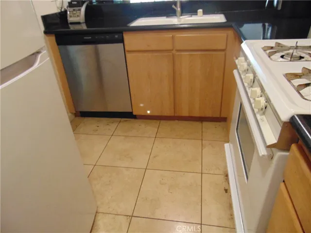 a view of a house with backyard swimming pool and sitting area
