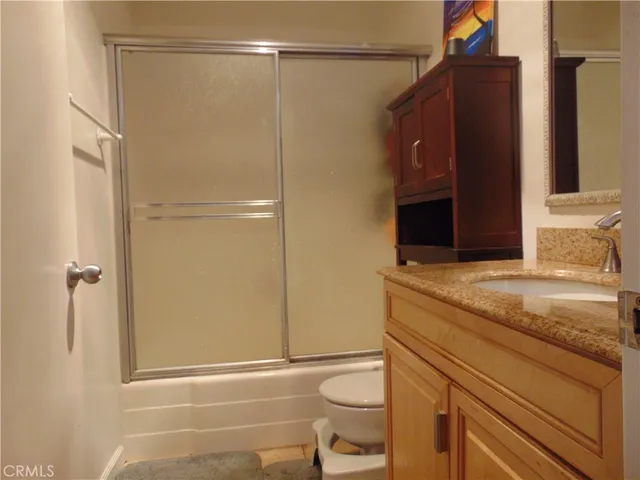 a backyard of a house with lots of green space and fountain