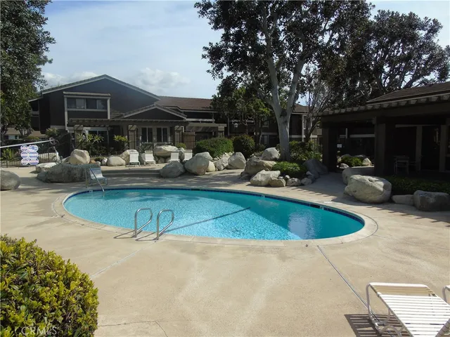 a view of a terrace with chairs and potted plants