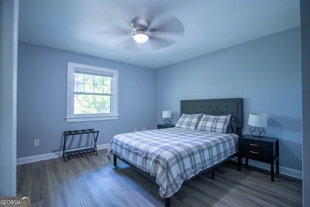 a bedroom with a bed and a table