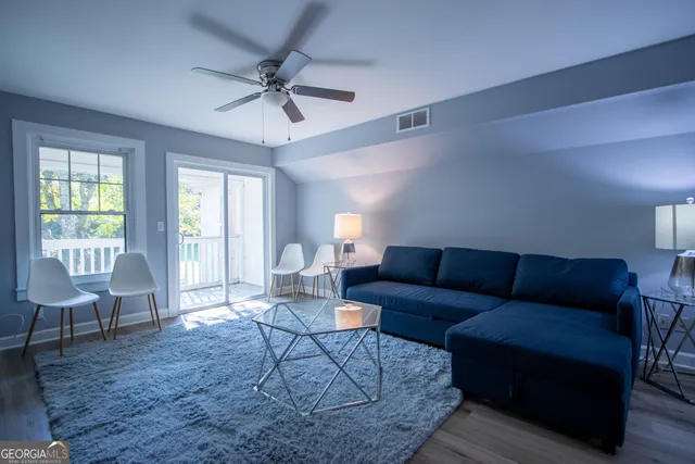 a living room with furniture and a window