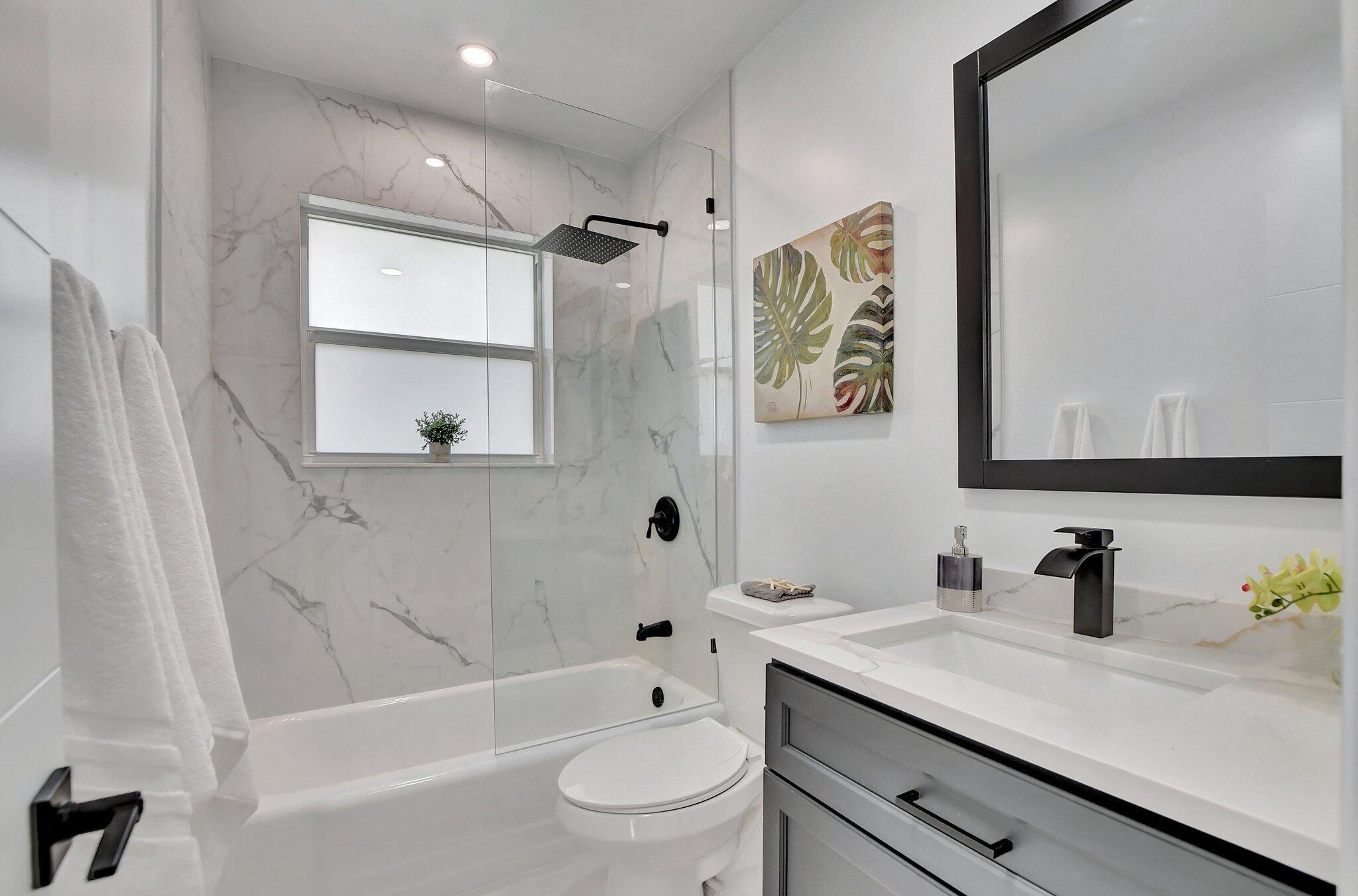 832 Southwest 10th Avenue Boca Raton, FL 33486 - Photo 28 of 57 a bathroom with a sink a toilet and a bathtub