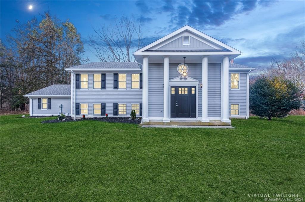 a front view of a house with a yard