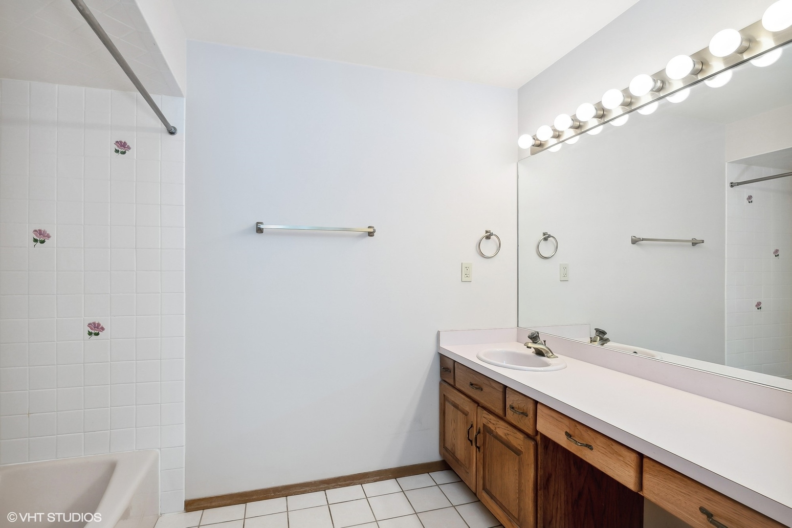 3108 Woodland Drive, Unit 3108 Zion, IL 60099 - Photo 11 of 15 a bathroom with a sink a vanity and a mirror