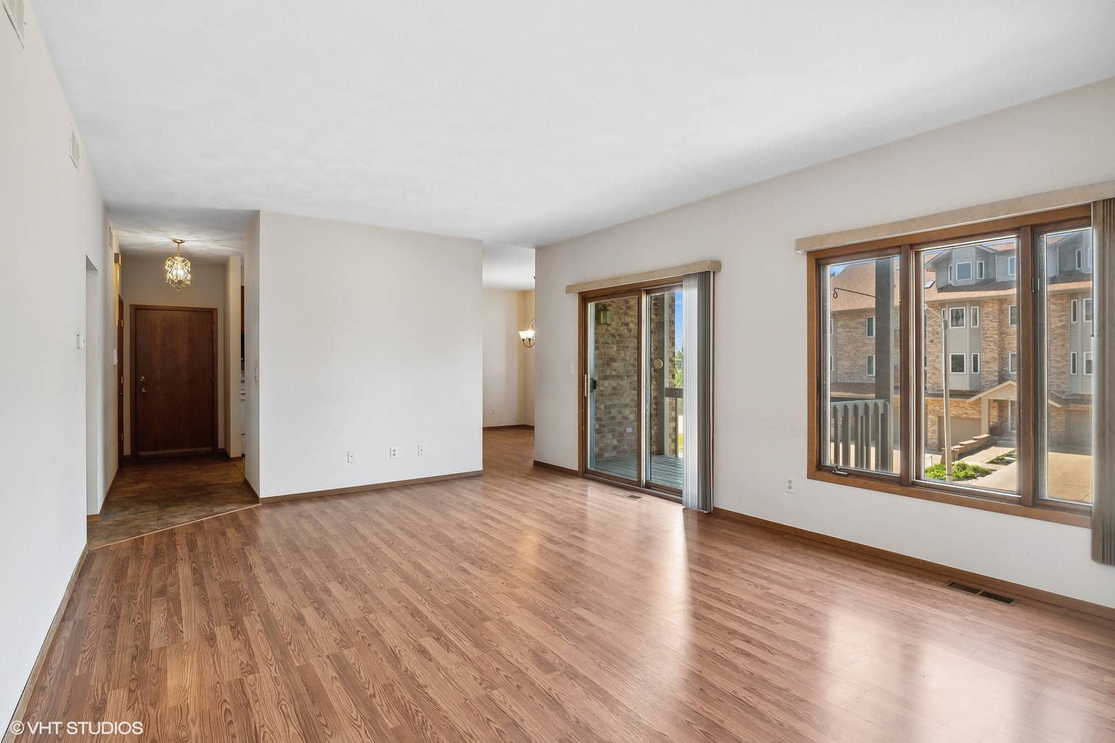 3108 Woodland Drive, Unit 3108 Zion, IL 60099 - Photo 3 of 15 a view of an empty room with glass door and a window