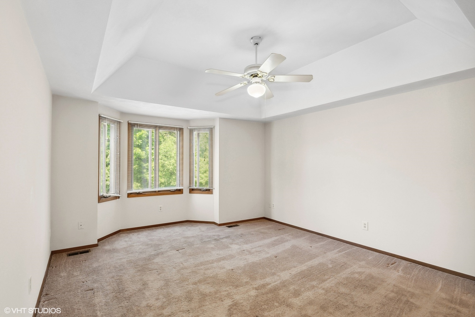 3108 Woodland Drive, Unit 3108 Zion, IL 60099 - Photo 10 of 15 an empty room with a window and a fan