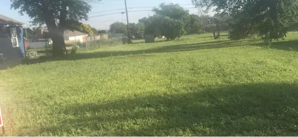 a view of field with trees