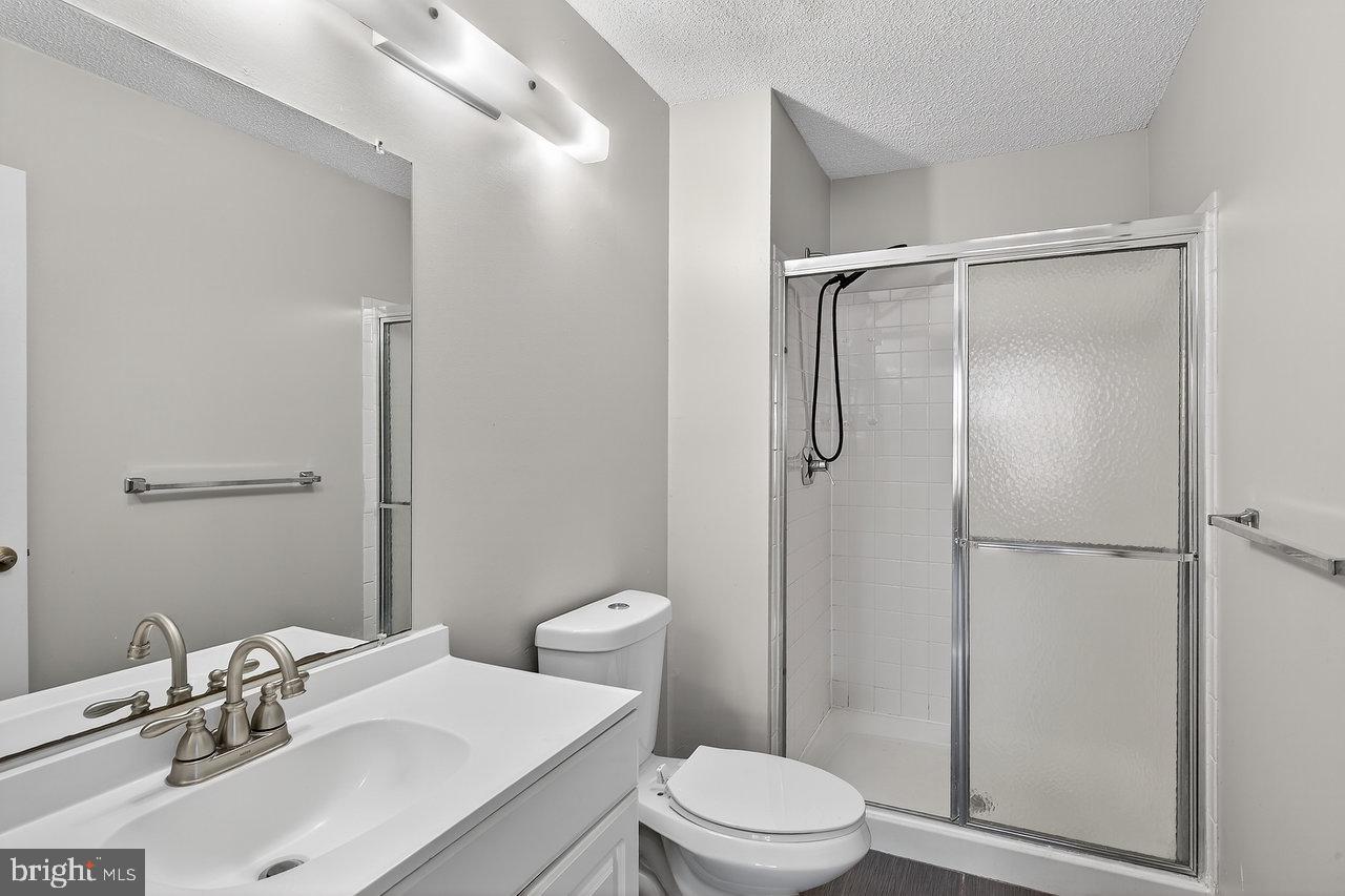41 Rickard Court, Unit 41 Lawrenceville, NJ 08648 - Photo 12 of 15 a bathroom with a sink toilet and shower