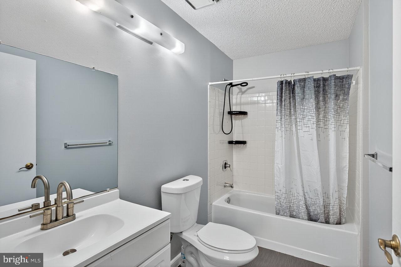 41 Rickard Court, Unit 41 Lawrenceville, NJ 08648 - Photo 14 of 15 a bathroom with a sink toilet and shower