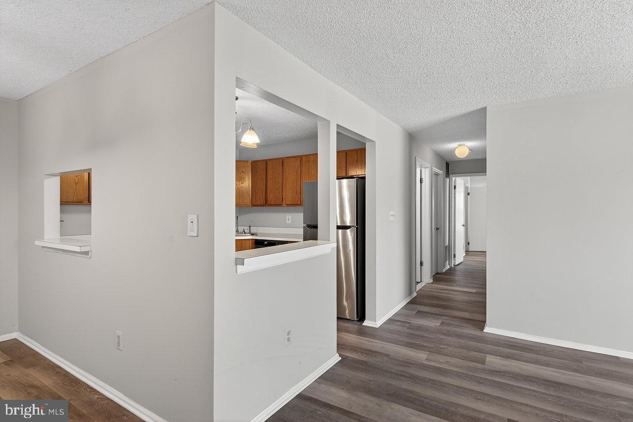 41 Rickard Court, Unit 41 Lawrenceville, NJ 08648 - Photo 2 of 15 a view of a hallway with wooden floor