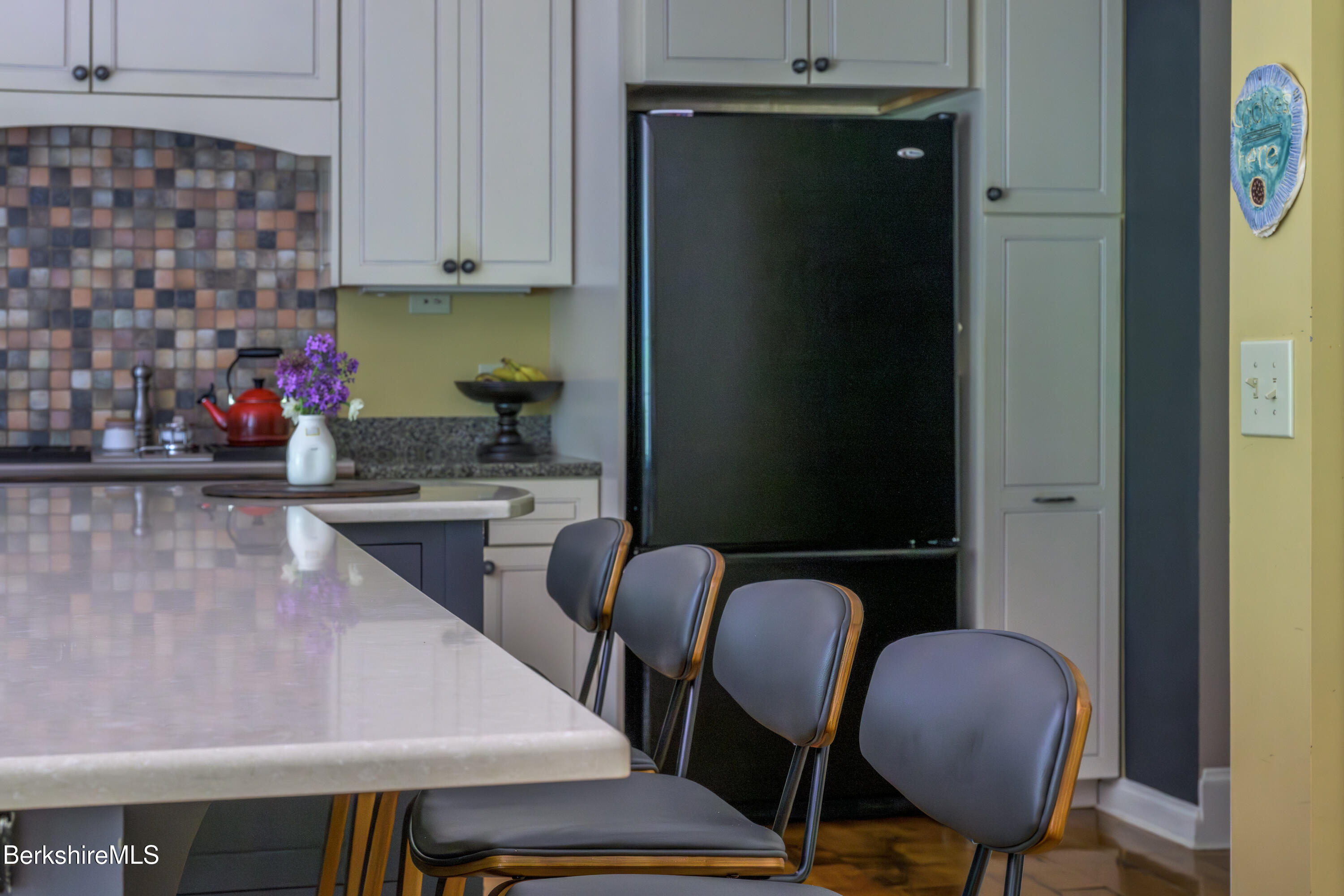 430 Lenox Road Richmond, MA 01254 - Photo 14 of 66 a kitchen with a table chairs and a refrigerator