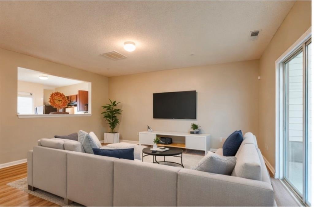 2837 Laurel Ridge Circle East Point, GA 30344 - Photo 4 of 11 a living room with furniture and a flat screen tv