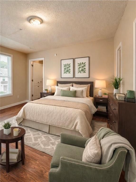 2837 Laurel Ridge Circle East Point, GA 30344 - Photo 8 of 11 a bedroom with a bed and wooden floor