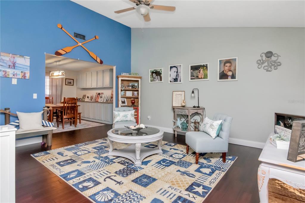 2604 Goldcrest Place Valrico, FL 33596 - Photo 11 of 72 a living room with furniture and a rug