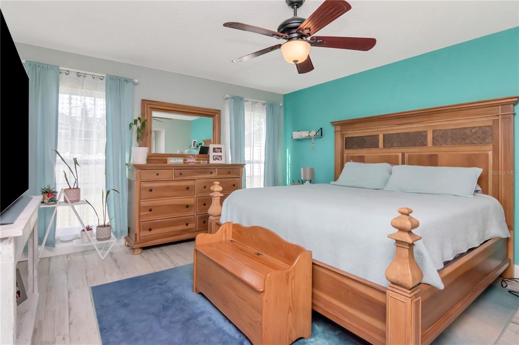 2604 Goldcrest Place Valrico, FL 33596 - Photo 20 of 72 a bedroom with a bed and a dresser