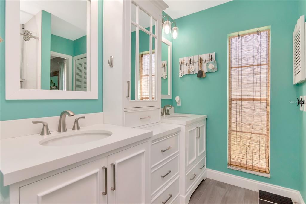 2604 Goldcrest Place Valrico, FL 33596 - Photo 21 of 72 a bathroom with a sink and a mirror