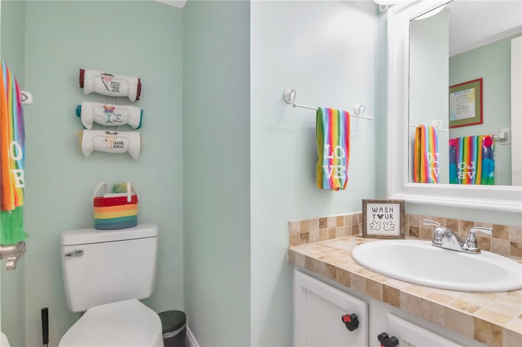 2604 Goldcrest Place Valrico, FL 33596 - Photo 23 of 72 a bathroom with a sink and a toilet