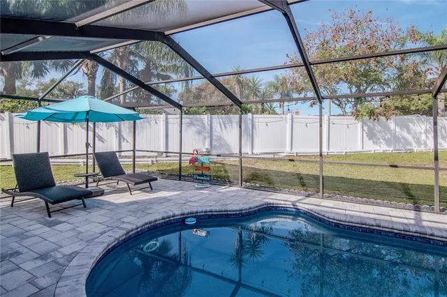 a view of a house with backyard and a slide
