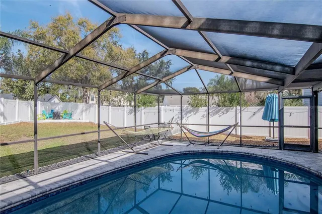 a view of outdoor space with playground and green space