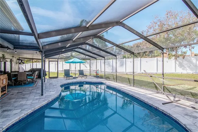 an aerial view of a house with a swimming pool