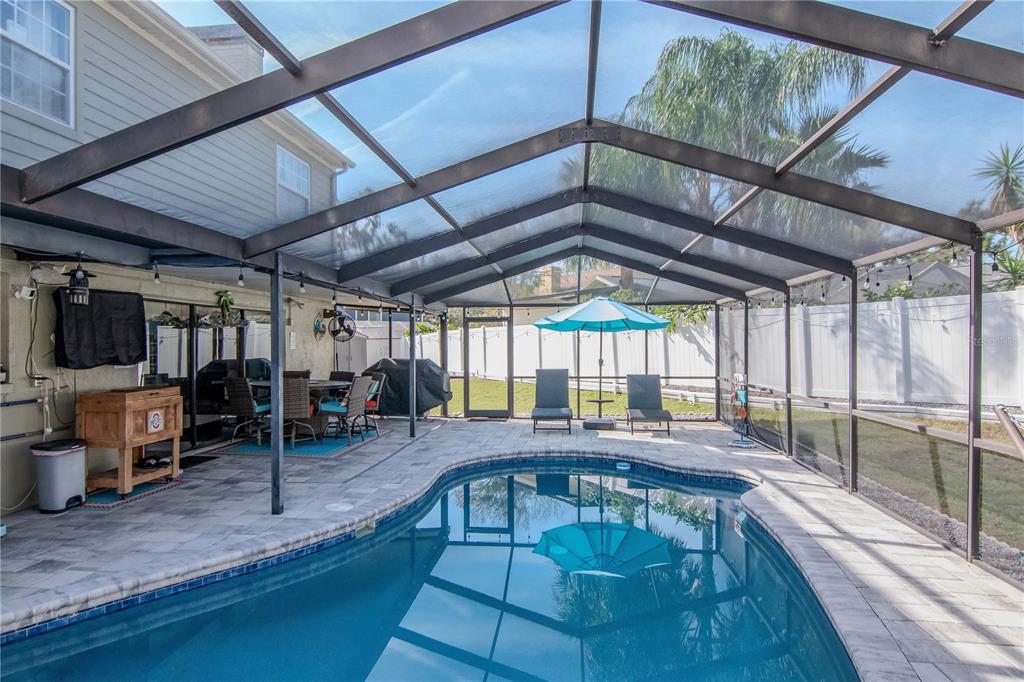 2604 Goldcrest Place Valrico, FL 33596 - Photo 38 of 72 a view of a swimming pool with a patio