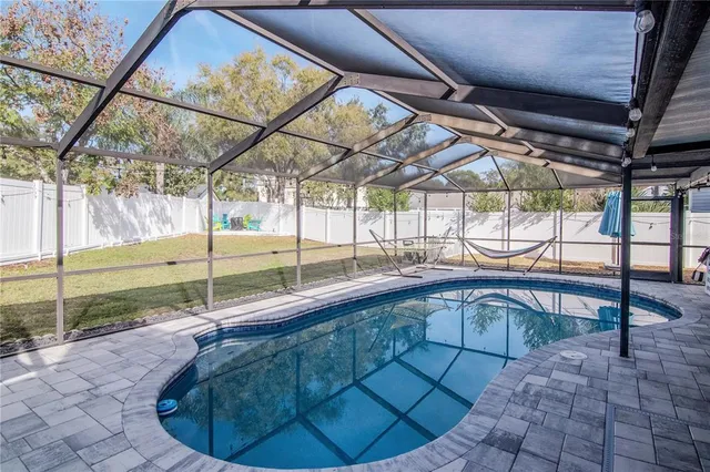 a view of a swimming pool with a porch