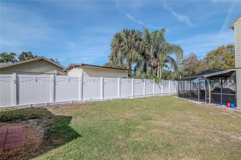 2604 Goldcrest Place Valrico, FL 33596 - Photo 41 of 72 a backyard of a house with lots of green space
