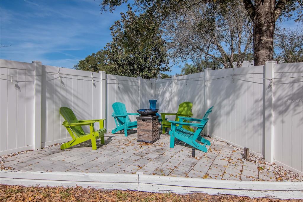 2604 Goldcrest Place Valrico, FL 33596 - Photo 46 of 72 a view of a backyard with plants and outdoor seating