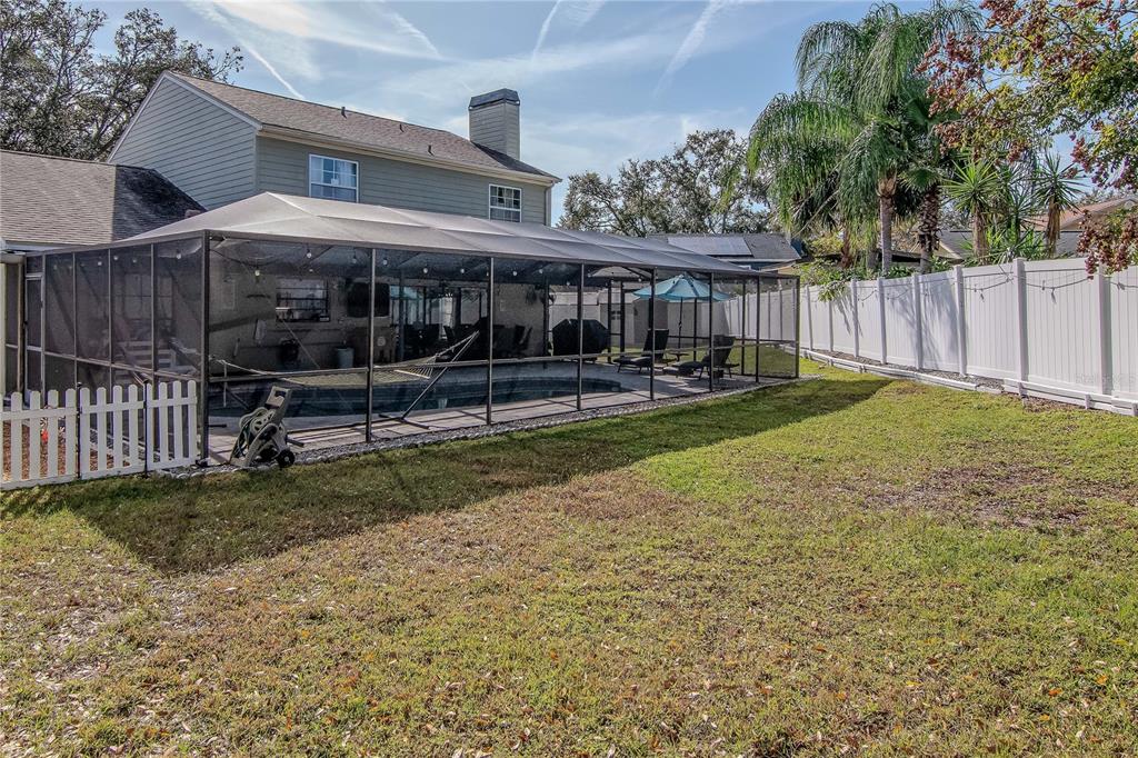 2604 Goldcrest Place Valrico, FL 33596 - Photo 47 of 72 a view of a house with backyard and a slide
