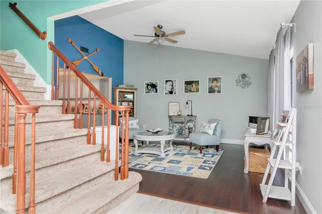 2604 Goldcrest Place Valrico, FL 33596 - Photo 6 of 72 a living room with furniture and wooden floor