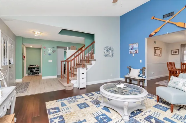 a living room with furniture and a rug