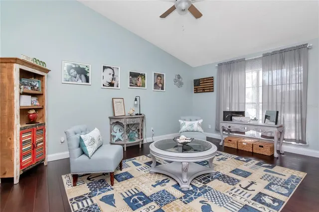 a kitchen with granite countertop stainless steel appliances a sink a counter top space and cabinets