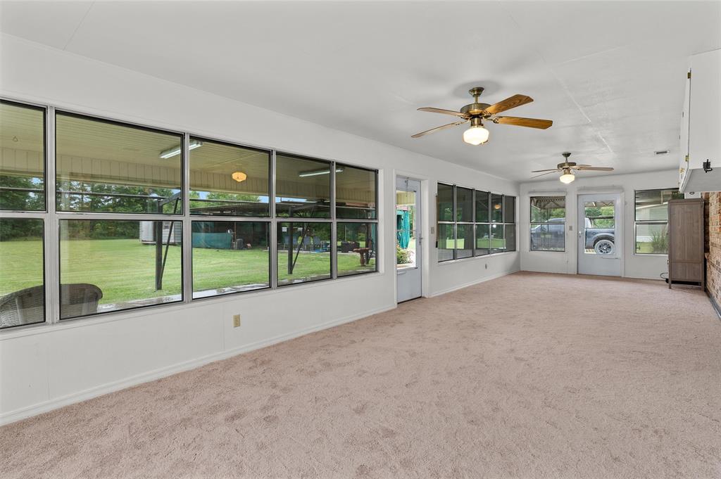 927 Stonewall-Preston Road Stonewall, LA 71078 - Photo 15 of 28 a view of an empty room with a sliding door