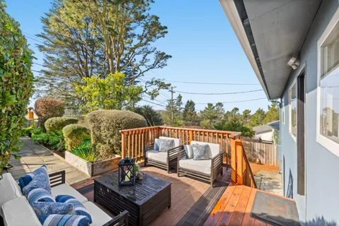 a view of a patio with furniture