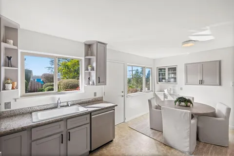a living room with furniture and windows