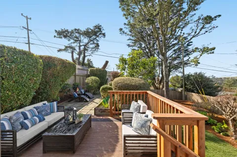 a view of balcony with furniture