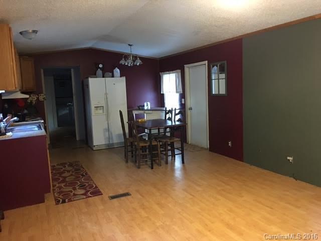 339 Mamie Hamilton Road Bostic, NC 28018 - Photo 3 of 8 a view of dining room with furniture and chandelier