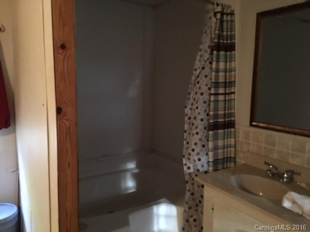 339 Mamie Hamilton Road Bostic, NC 28018 - Photo 6 of 8 a bathroom with a sink and a shower