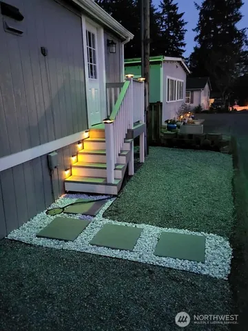 a front view of a house with a garden