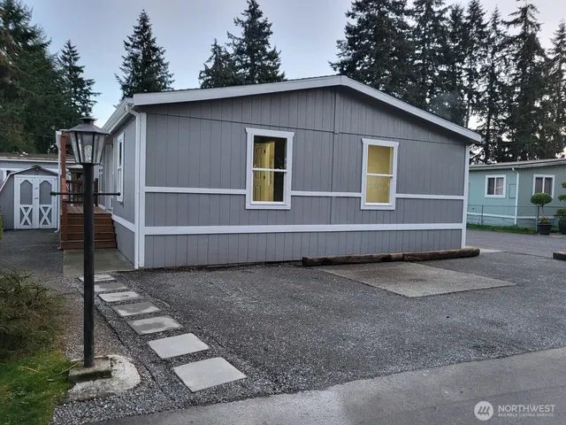 a house with trees in the background