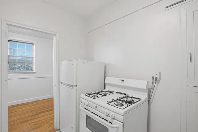 a white refrigerator freezer and a stove
