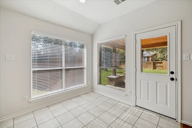 a kitchen with stainless steel appliances granite countertop a sink refrigerator stove and microwave