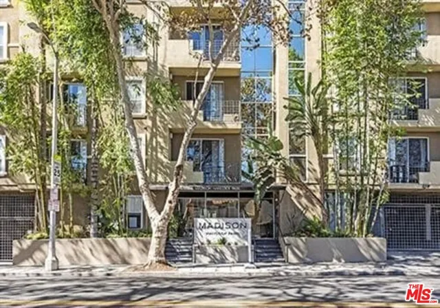 a view of a building with a street
