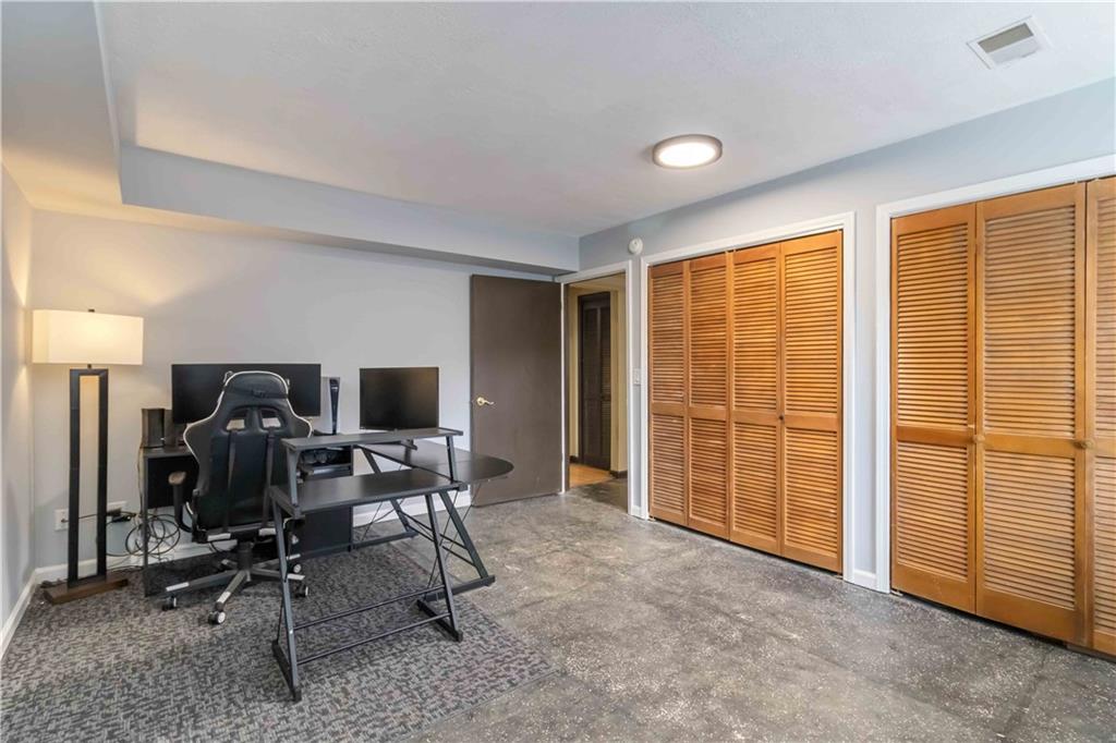 65 Hinton Court Dacula, GA 30019 - Photo 30 of 40 a view of a workspace with furniture and a window