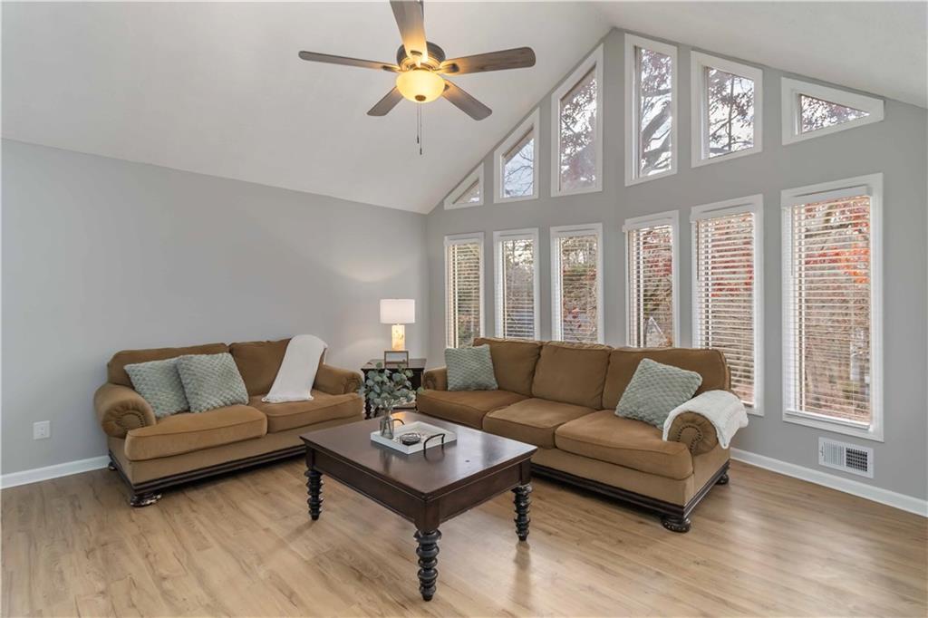 65 Hinton Court Dacula, GA 30019 - Photo 7 of 40 a living room with furniture a rug and a window