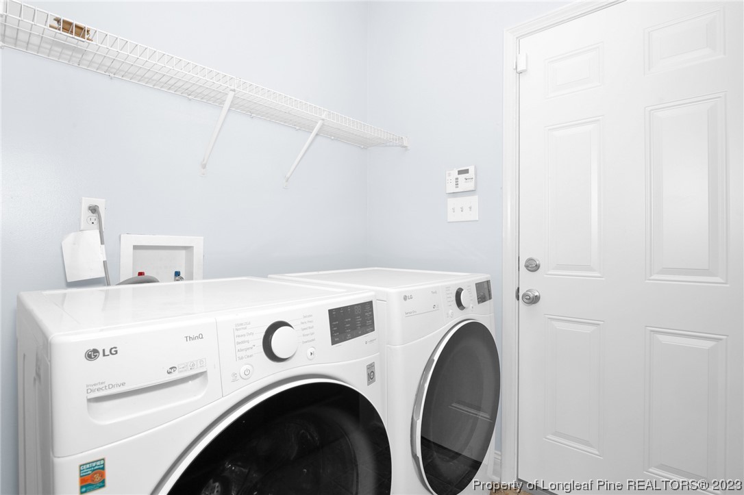 159 Boswell Street Raeford, NC 28376 - Photo 16 of 34 a utility room with dryer and washer