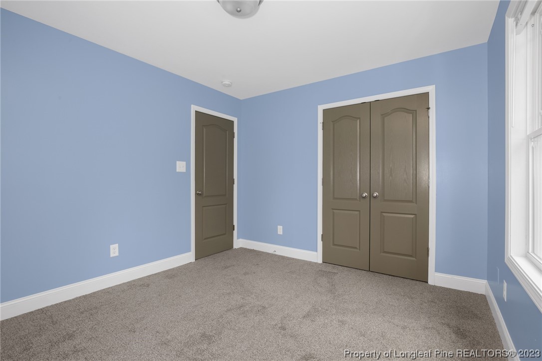 159 Boswell Street Raeford, NC 28376 - Photo 23 of 34 an empty room with closet and a bathroom